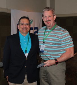 Jose Milan of Bayer, presents Larry Aylward with the Plant Health Writer of the Year Award.